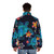 A puffer jacket featuring a watercolor design of a sea turtle surrounded by tropical flowers - men back