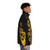 Saxophone Keywork Puffer Jacket featuring a silhouette of a saxophone player against a reflective, metallic background - men side right