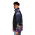 A person wearing a puffer jacket with a space and galaxy-inspired design, including stars, planets, and a silhouetted ship. - men side left