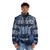 A person wearing a snow leopard-patterned puffer jacket, standing in a snowy landscape. - men front