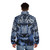 A person wearing a snow leopard-patterned puffer jacket, standing in a snowy landscape. - men back