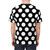 Closeup of a black t-shirt with large white polka dots - men back