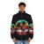 Puffer jacket with a scenic sunset landscape, trees, and wildlife silhouettes - men front
