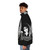 Model wearing a black puffer jacket with Siouxsie and the Banshees-inspired gothic design - men side left