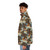 A puffer jacket with a vibrant design featuring wildlife and the iconic baobab tree. - men side left