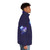 A whimsical puffer jacket featuring a silhouette of the Cheshire Cat from Alice in Wonderland, set against a night sky with stars and the moon. - men side right