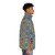 Dragon Con Marriott Carpet Puffer Jacket featuring a vibrant red, blue, and yellow striped pattern with circles and diamonds - men side right