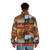 Colorful puffer jacket featuring autumnal landscape inspired by Canadian painter Tom Thomson - men back