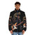 A dinosaur playing a guitar on a puffer jacket, a fun and unique prehistoric rock music lover gift. - men front