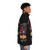 A dark carnival-themed puffer jacket featuring the Pupfest 2024 logo - men side right