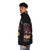 A dark carnival-themed puffer jacket featuring the Pupfest 2024 logo - men side left