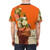 A bright, abstract floral graphic design on a white t-shirt against a vivid orange background. - men back