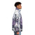 A realistic purple puffer jacket with a castle in the sky and wolves in a winter forest scene. - men side right