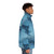 Puffer jacket in a frosty blue color with a vintage, textured pattern - men side right