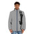 Black cat holding on to a puffer jacket with its claws, showcasing a fun, expressive cat personality - men front