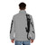 Black cat holding on to a puffer jacket with its claws, showcasing a fun, expressive cat personality - men back
