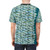 Vibrant t-shirt featuring a school of bait fish in green and blue shades - men back