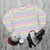 Colorful horizontal rainbow stripe sweatshirt - flat lay