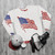 Patriotic American flag sweatshirt with vintage stars and stripes design - flat lay