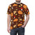 A t-shirt featuring a digital art design of an autumnal nature pattern with leaves, berries, pumpkins, and other fall elements. - men front