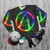 Colorful abstract rainbow splash vault hunter symbol on a black sweatshirt - flat lay