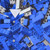 Vibrant blue Hawaiian shirt with a repeating lego-style brick pattern - Detail
