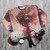 Vibrant phoenix bird sweatshirt with fiery feathers and mythical design - flat lay