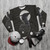 Wings of Fire Darkstalker Sweatshirt featuring dragon, nightwing, and icewing designs - flat lay