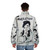"Migration Is Not A Crime" puffer jacket with Banksy-inspired political street art - men back