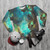 Green galaxy sweatshirt with cosmic nebula design - flat lay