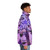Model wearing a Medusa-themed puffer jacket with abstract patterns and nature-inspired design - men side right