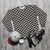 Black and white fish scale geometric pattern sweatshirt - flat lay