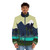 Model wearing a blue and green puffer jacket in a snowy, forested landscape - men front