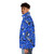 Blue puffer jacket with a colorful, repeating building blocks pattern inspired by Lego - men side left