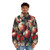 Person wearing a light-up Christmas puffer jacket with festive decorations - men front