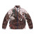 A cozy puffer jacket with a nature-inspired design featuring a mountain landscape, wildlife, and botanical elements