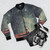 Vintage-inspired nostalgic bomber jacket with collage design featuring space, stars, and retro elements - Flat lay