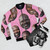 A bomber jacket featuring the popular "Surprised Shaq" meme design. - Flat lay