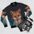 Photograph of a cute fox bomber jacket with autumn leaves and nature elements. - Flat lay