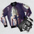 A black bomber jacket with the album cover art for "Going to Hell" by the rock band The Pretty Reckless. - Flat lay