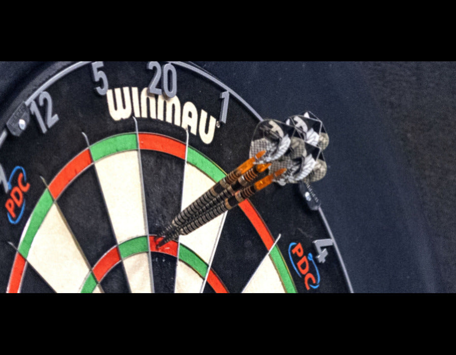 Darts in play in a home game room