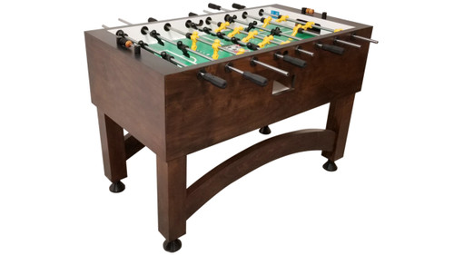 Dark wood foosball table with arched legs, green and yellow players on metal rods, isolated on white background.