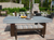 R&R Outdoor South Beach Pool Table set on a backyard patio with optional dining top shown with bottle of wine, charcuterie board, and pitcher of water.