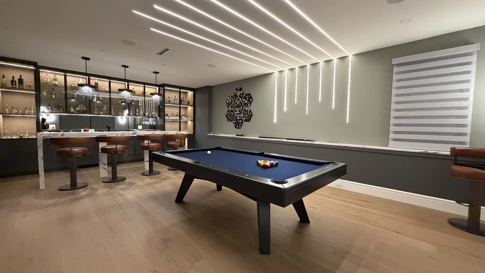 Canada Billiards Luxx pool table in a modern Home Billiards game room with a bar.