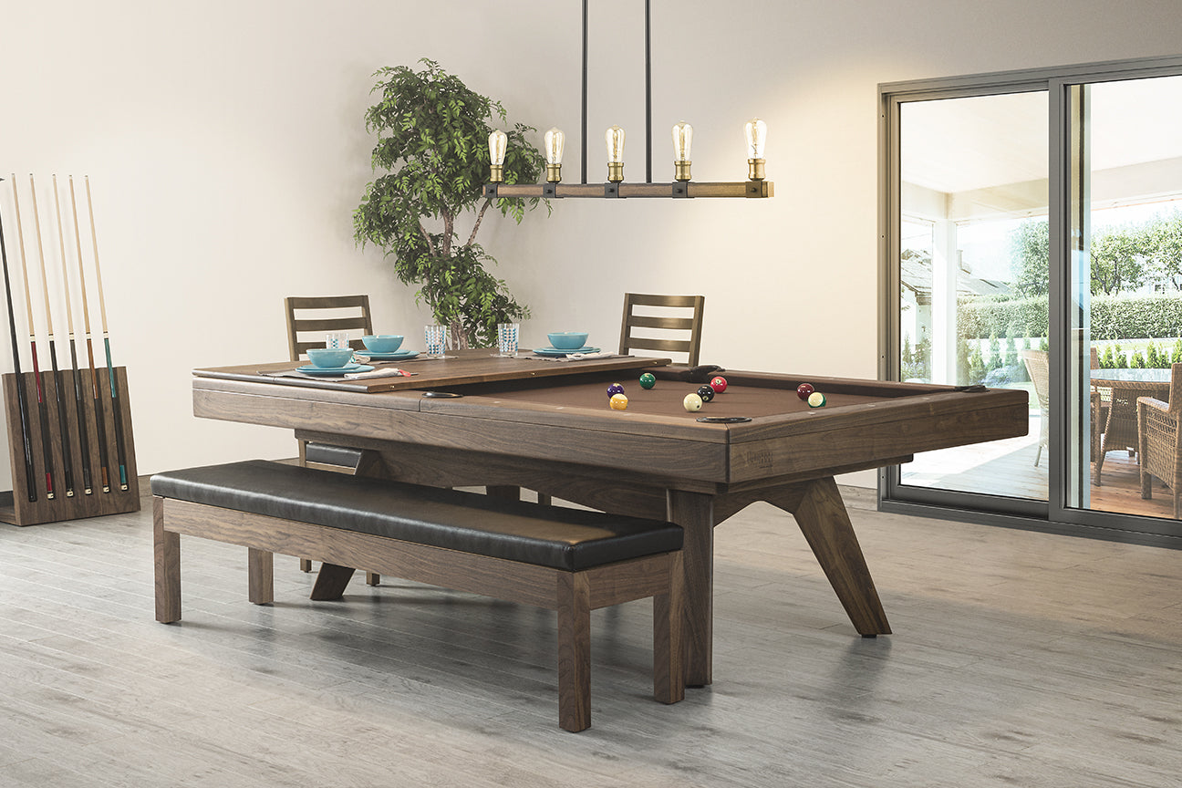 Pool table with a dining top in a bright modern room.