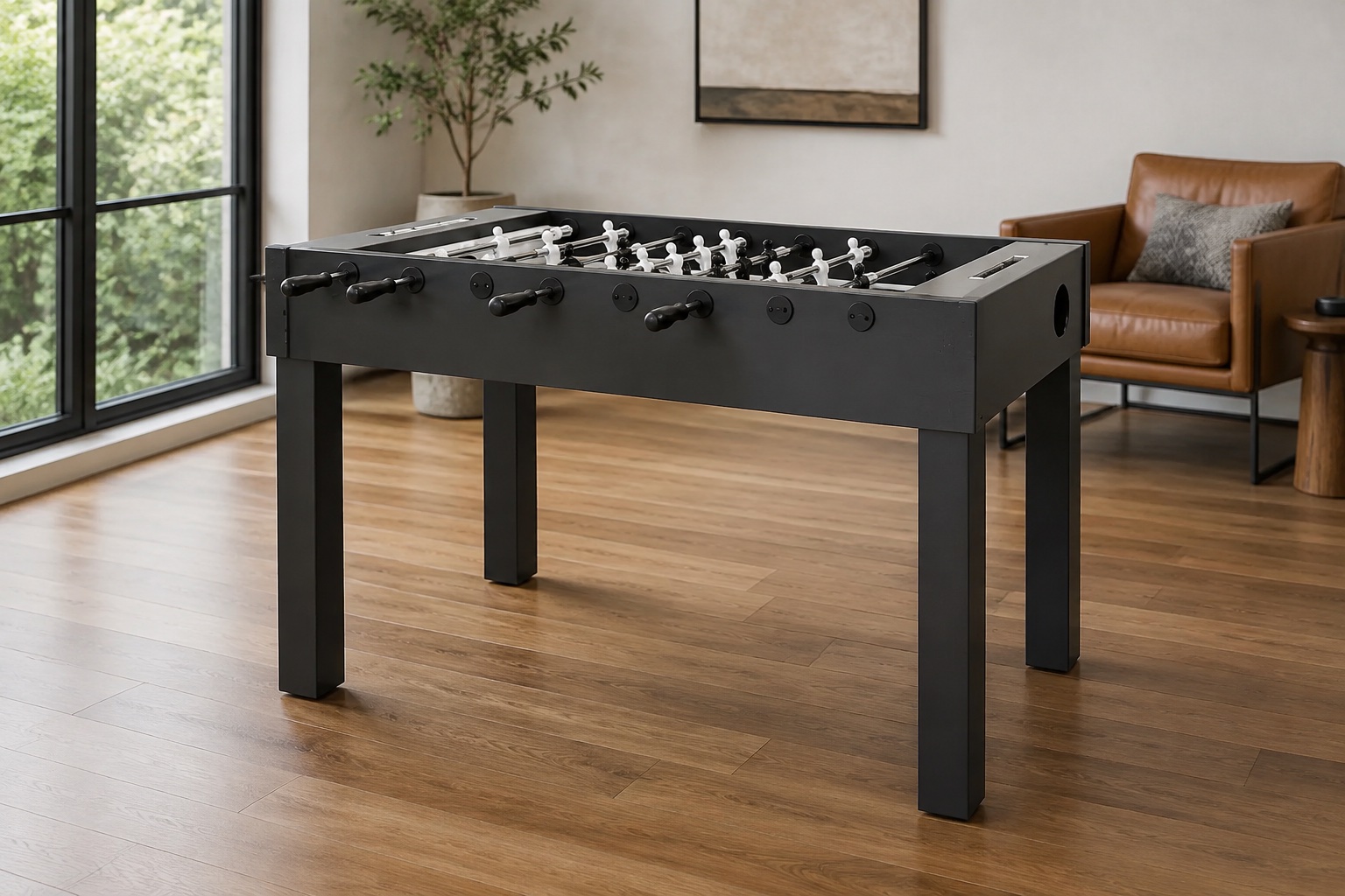 Foosball table in a bright, furnished game room