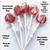 Product descriptive photo with five bright colored red lollipops with blue dots on long white paper sticks, in clear bags with twist ties,  showing the back of lollipop ingredient and nutrition facts label, all on a light pink background.