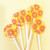 Five bright yellow, round, smooth, glossy hard candy Banana Cream Lollipops with extra long white paper lollipop sticks, each with coral pink color pinwheel flavor flowers on a light butter yellow color background.