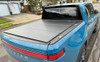 Access LOMAX Tri-Fold Cover - Matte Black - 2022-2025 Rivian R1T 4ft 6in Bed (w/ OEM Tonneau Track) - B1080019