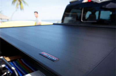 Roll-N-Lock Retractable (Electric) Tonneau Cover, Aluminum Slats - 2020-2026 Chevrolet Silverado / GMC Sierra 2500HD 3500HD 6'9" Bed - RC226E